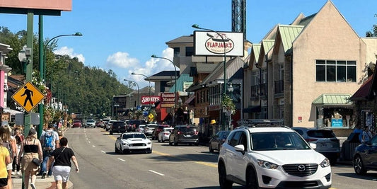 visitors drive through downtown Gatlinburg